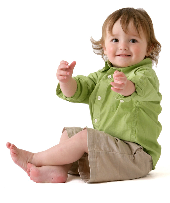 photo of young child doing hand signs
