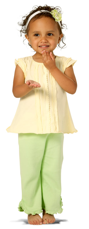 photo of young girl doing hand signs